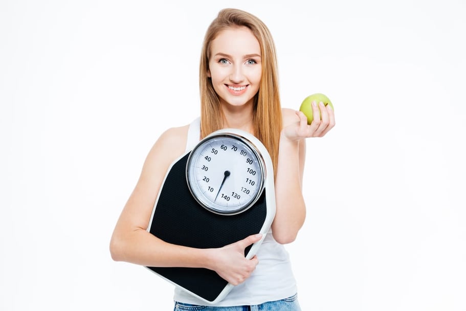 Young Healthy Girl On Home Scales Stock Photo - Download Image Now